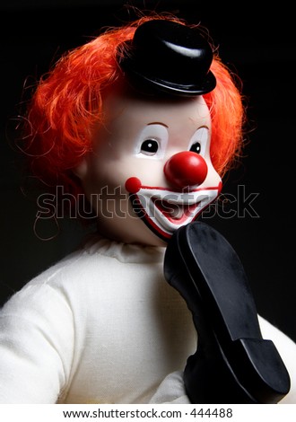 Clown with foot in his mouth