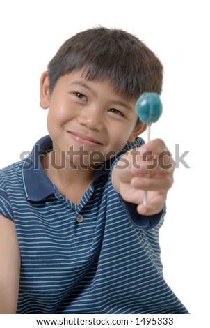 boy offering a lollipop
