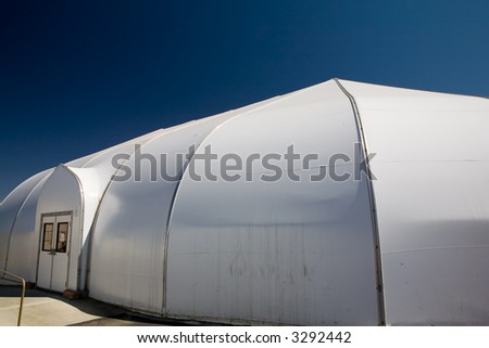 Outside shot of a white dome shape plastic tent used as a worship center at a church