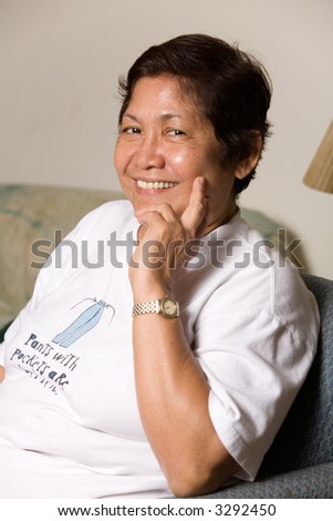 Portrait of a senior asian woman smiling with hand on face