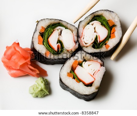Three pieces of sushi on white