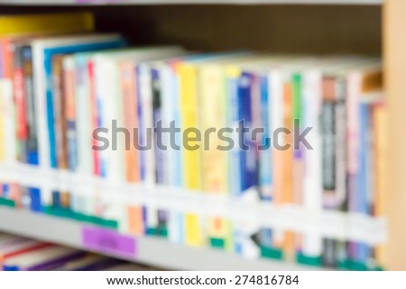 Blurred books in public library. Blurred effect. Background for you pictures