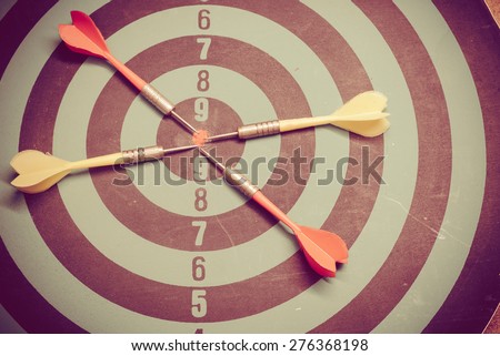 Vintage retro picture style - Dart is an opportunity and Dartboard is the target and goal. So both of that represent a challenge.