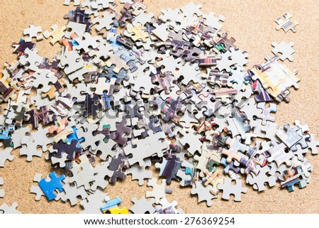 jigsaw puzzle on wooden background