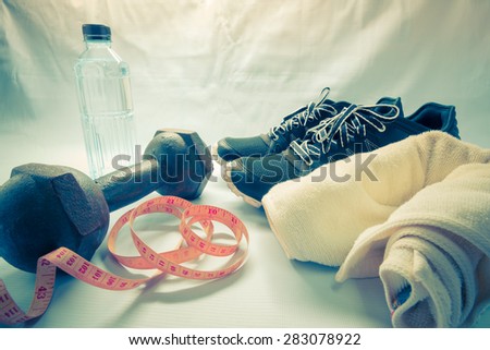 Pair of sport shoes and fitness accessories - Vintage retro picture style