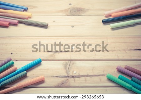 Colorful markers pens Multicolored Felt Pens draw line on wooden board - Vintage retro picture style