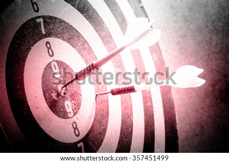 Dark and red tone - Dart is an opportunity and Dartboard is the target and goal with vintage retro picture style. success/fail business concept. Bullseye and Dart.