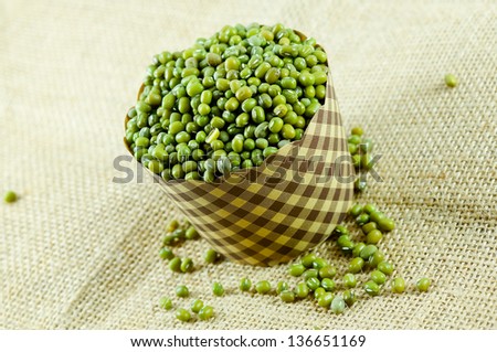 Green bean or mung bean on the sacks background.