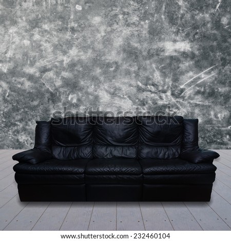leather sofa in cement  room.
