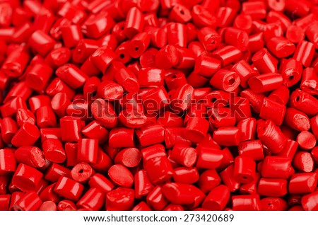 Little red plastic grains as background