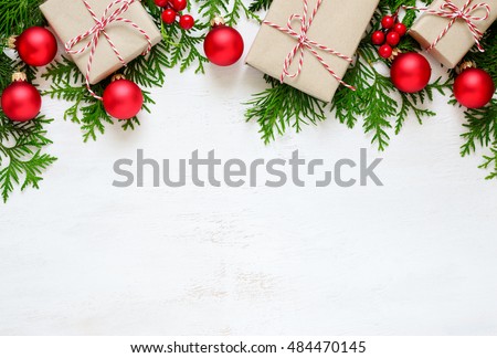 Christmas or New Year background, plain composition made of Xmas decorations and fir branches, flat lay, blank space for a greeting text