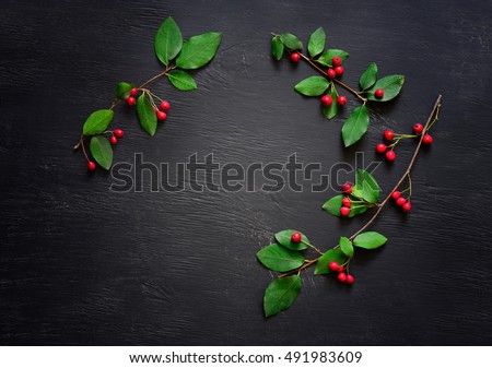 Christmas simple rustic dark background with a space for a greeting text, flat lay