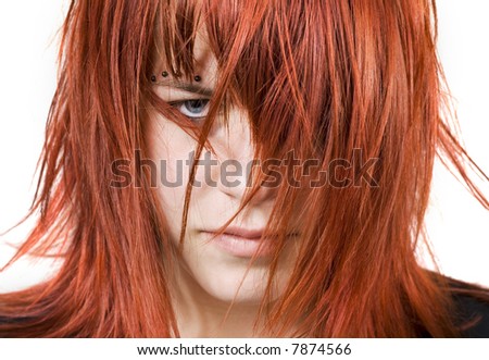 stock photo Cute redhead girl looking aggressively at the camera with
