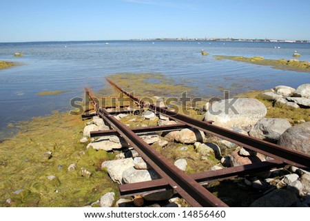 Road to the sea - Old rails for descent of a boat in water