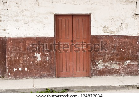 Old wooden Door in Old wall colonial Latin America