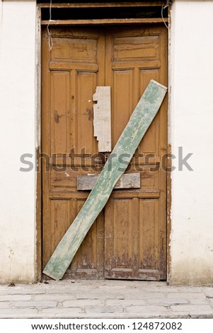 Old wooden Door in Old wall colonial Latin America