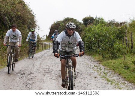 ZAMORA REGION, ECUADOR-JULY  13 2013:Riders  in the rain and mud in the Andes Mountains on July 13, 2013. Governments in Ecuador are actively promoting fitness activities.