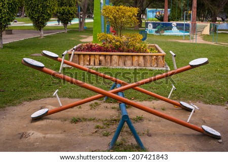 Older playground equipment in Ecuador, teeter-totter, seesaw