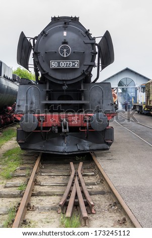 BEEKBERGEN, NETHERLANDS - MAY 19 , 2013: steam train from the Veluwsche steam train company  is waiting  for maintenance at  the historic railway station in Beekbergen in the Netherlands.