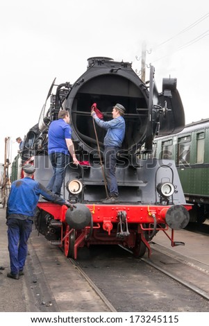 BEEKBERGEN, NETHERLANDS - MAY 19 , 2013: steam train from the Veluwsche steam train company  is waiting  for maintenance at  the historic railway station in Beekbergen in the Netherlands.