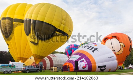 BARNEVELD, THE NETHERLANDS - AUGUST 28: Colorful air balloons taking off at international balloon festival Balloonfiesta on August 28,2014 in Barneveld, The Netherlands