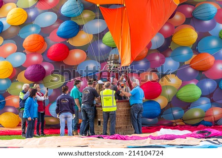 BARNEVELD, THE NETHERLANDS - AUGUST 28: Colorful air balloons taking off at international balloon festival Ballonfiesta on August 28,2014 in Barneveld, The Netherlands
