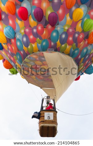 BARNEVELD, THE NETHERLANDS - AUGUST 28: Colorful air balloons taking off at international balloon festival Ballonfiesta on August 28,2014 in Barneveld, The Netherlands