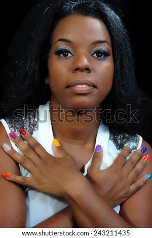 Close Up of a young black woman with painted nails