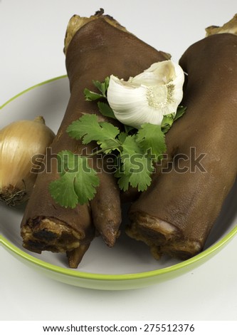 Smoked pig feet in dish