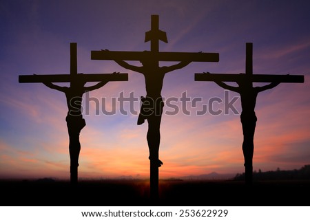Jesus on the cross in sun rise blur background