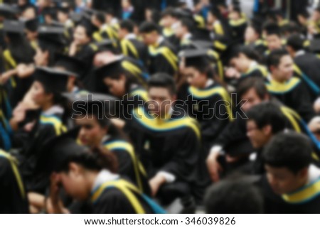Graduation ceremony in university auditorium.