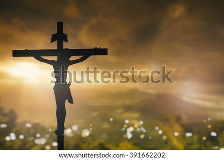 Silhouette of Jesus Christ with Cross over sunset concept for religion worship Christmas Easter Redeemer Amazing grace prayer and praise dramatic sky vintage redeemer life revelation love world