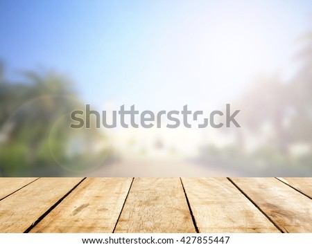 Wooden board table  in front of blurred pattani public mosque background. concept for islam allah ramadan pray muslim hope faith war holy World Environment Day\
eid Mubarak