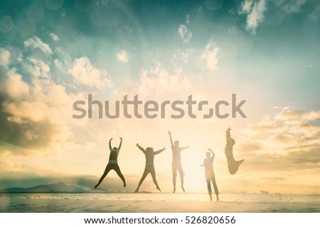 Silhouette of cheering young generation jumping on outdoor beautiful Rear view background. relax lifestyle hope faith love grow kid hands Happiness fitness exercising volleyball future party relation