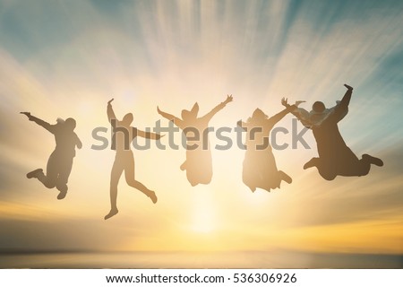 Silhouette of cheering young generation jumping on outdoor beautiful Rear view background. relax lifestyle hope faith love grow kid hands Happiness fitness volleyball exercising future party relation