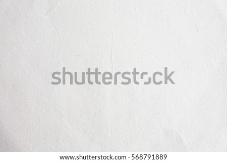 Old eco paper kraft texture in white light on table concept for creative flat card background design. Pattern of simple raw surface use decorative for image cardboard recycle and new earth tone theme.