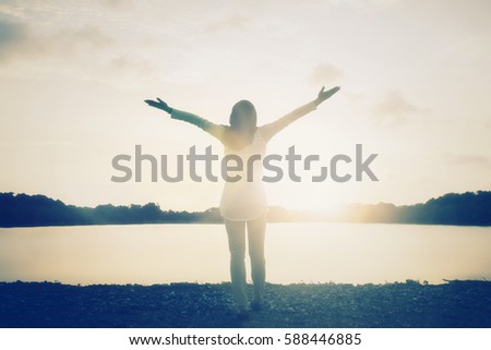 Silhouette woman with hands rise up on beautiful view. Christian praise on hill thanksgiving day background. consumed by wanderlust nature standing open arms enjoying sun concept fun world wisdom