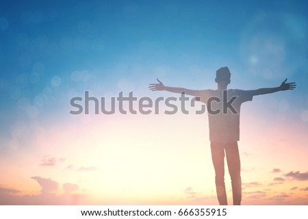 Silhouette man with open arms rise up on beautiful view. Christian feel praise on good friday background. man motivation confident on peak nature the sun concept world health wisdom fun hope.