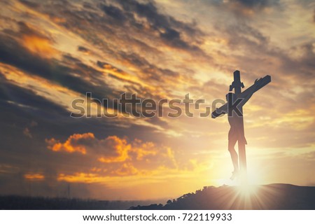 Silhouette of Jesus christ crucifix on cross over heaven sunset concept for catholic religion, christian worship, Christmas, happy Easter Day, Thanksgiving prayer and praise  good friday, bible