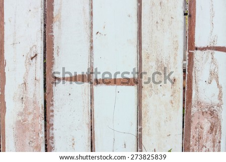 Rural people to bring old planks make is fence around the house.