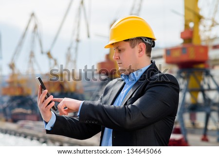 Port engineer is using the digital tablet