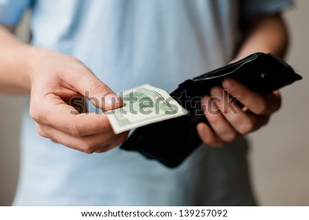 Man gets money from the wallet