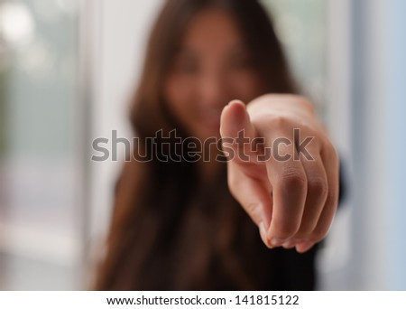 Chinese woman shows an index finger