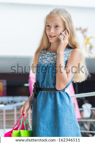 girl speaks by phone