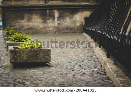stone flower beds against wall