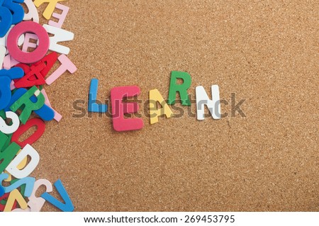 Colouful word learn with background cork board