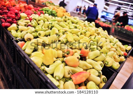 Variety of peppers in boxes in supermarket