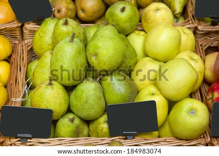 Apples and pears on sale in a supermarket
