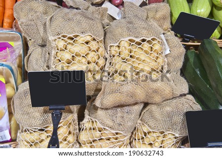new potatoes in bags on the market