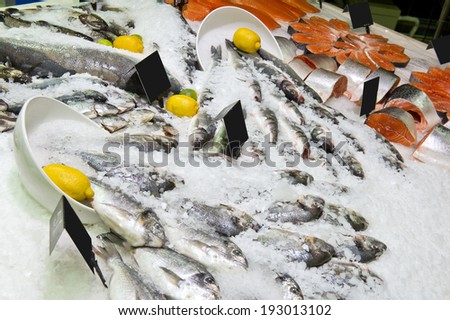 fresh live fish on ice on open market